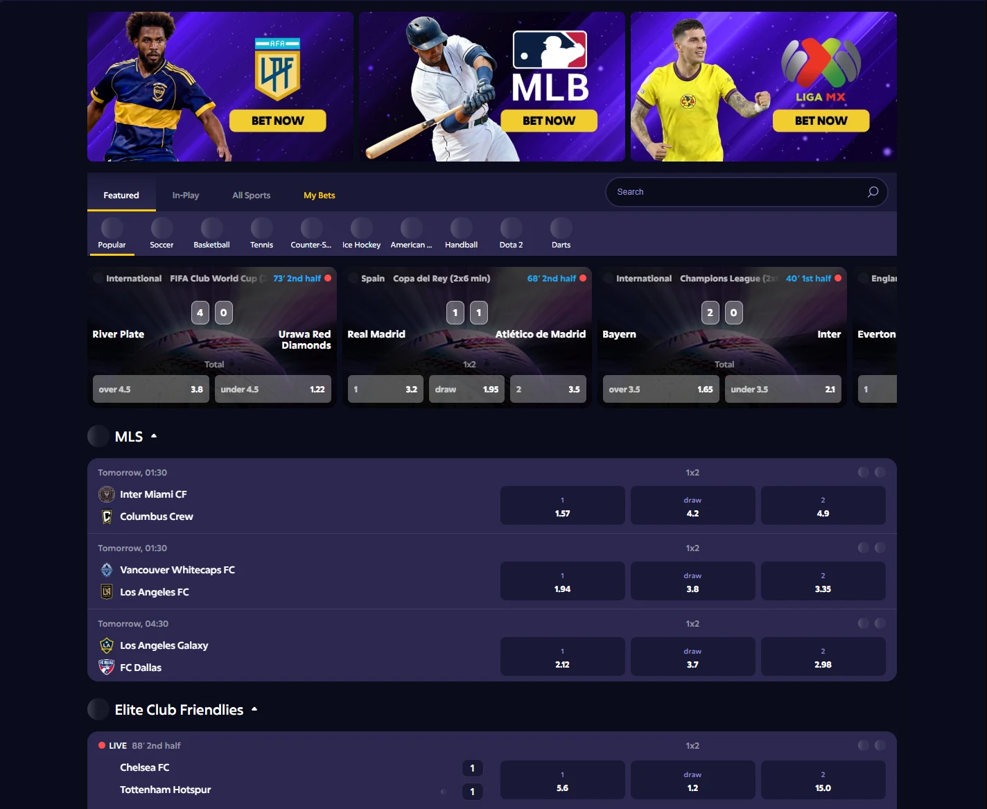 Roobet sportsbook showing league banners, Featured and In-Play tabs, a strip of sports including Counter-Strike and Dota 2, live match tiles with scores and odds, and MLS fixtures with 1x2 prices